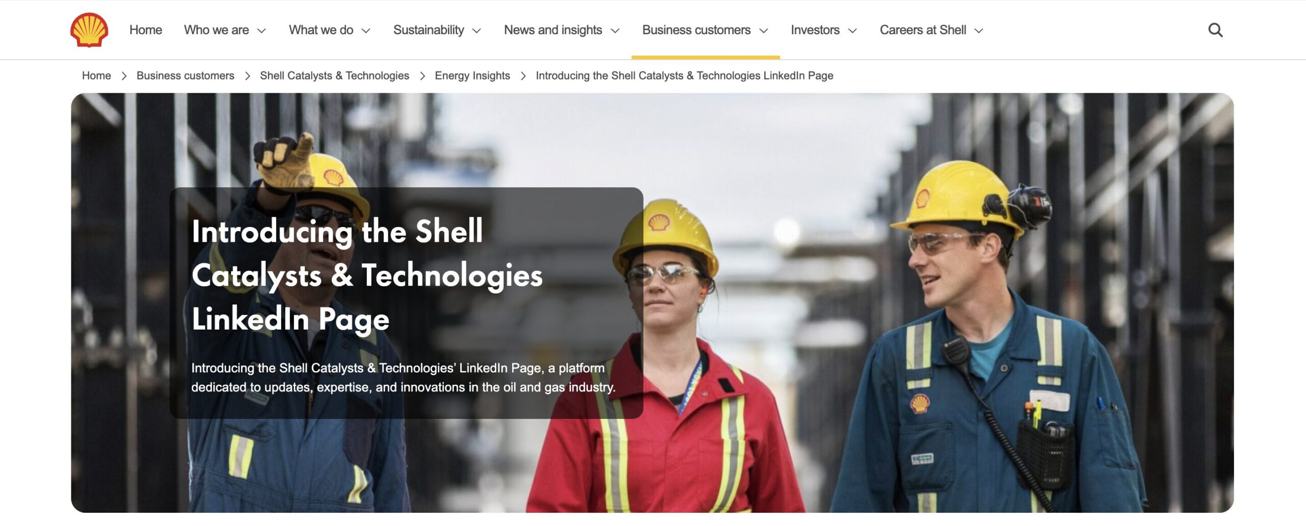 Energy professionals in hard hats at refinery