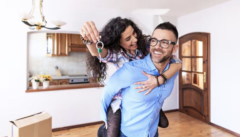 man and woman celebrating new house